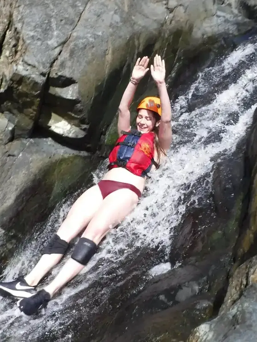 Natural rock waterslides adventure in the rainforest near El Yunque